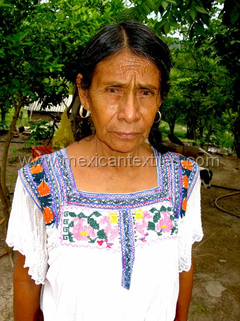 tula del rio17.JPG - Under the over blouse we can see here the traditional blouse of the region. This one is done in a cross stitch rather than pleated. During the visit in 2009 I saw both types. Tula de Rio is also a palm weaving town , but was paved and well organized.